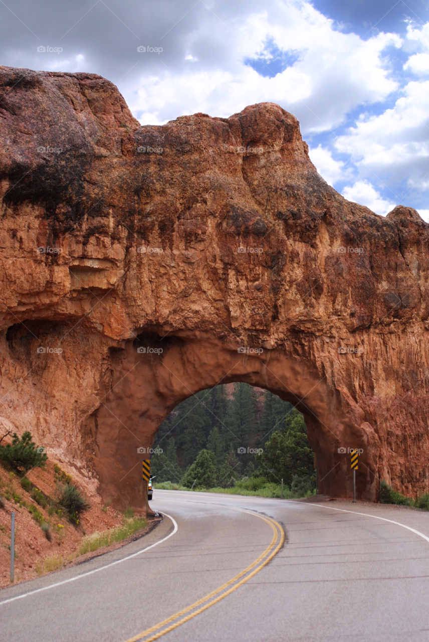 Stone tunnel on a drive through the forest 