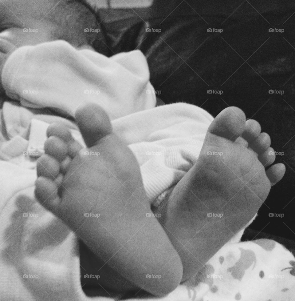 Baby's feet. My daughter's feet one week coming home from the hospital
