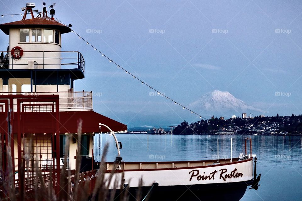 The Point Ruston is docked in Commencement Bay, Tacoma. Mount Rainier rests in the distance as evening approaches. 