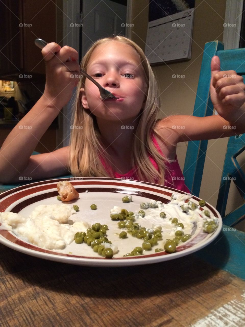 Little girl enjoying her veggies!