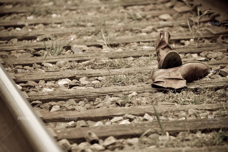 A lonely Pair of Boots left abandoned on the railroad tracks