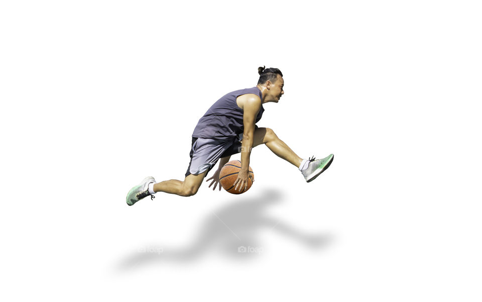 Isolated Basketball in hand man jumping on a white background with clipping path...