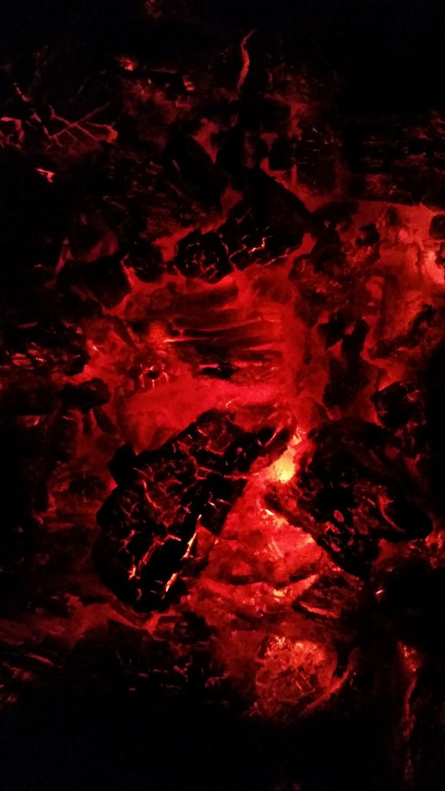 Burning charcoal on barbecue. Hot burning fire charcoal on barbecue BBQ like lava in volcano.