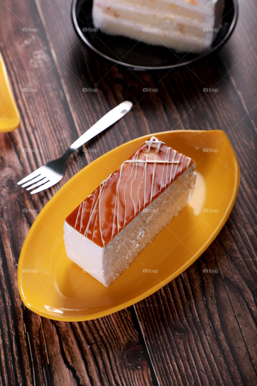 Caramel / cheese cake pastry on a wooden table