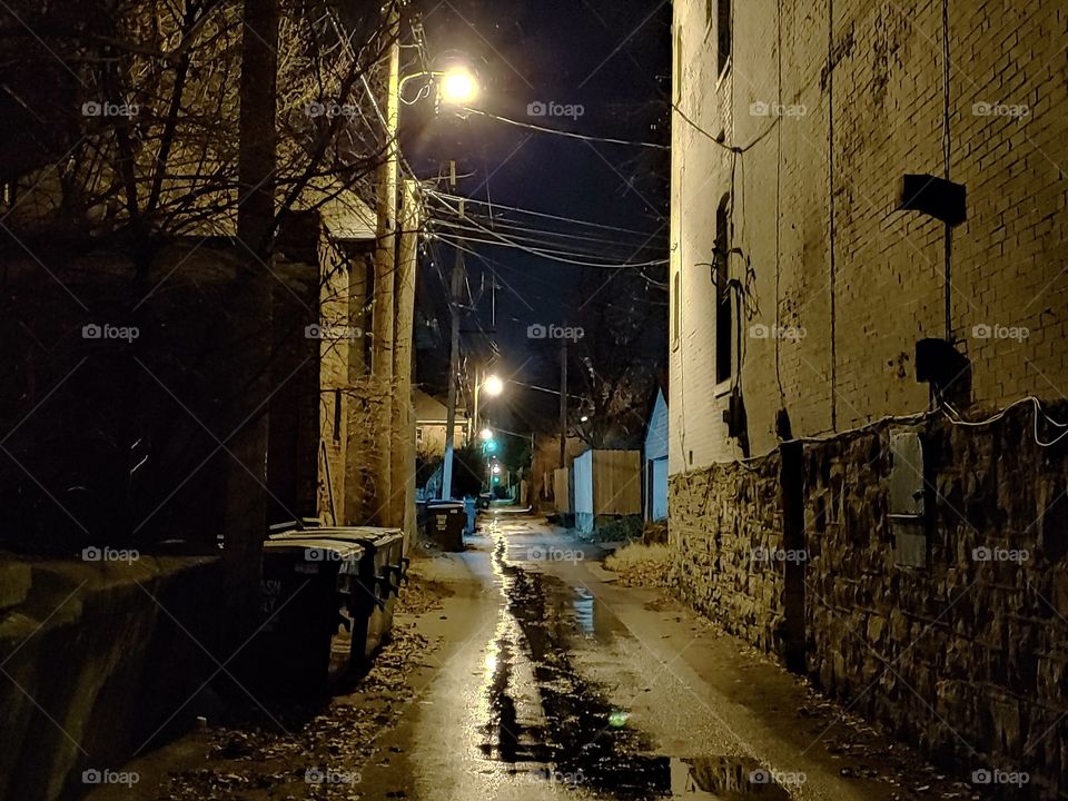 Dark alleyway late at night in St. Louis. urban city setting.