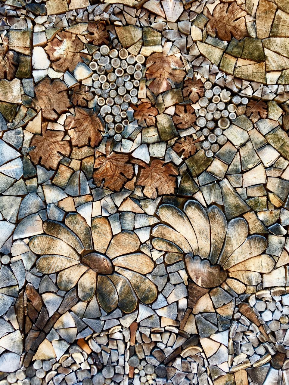 artistic composition executed with cut wood representing a mountain landscape