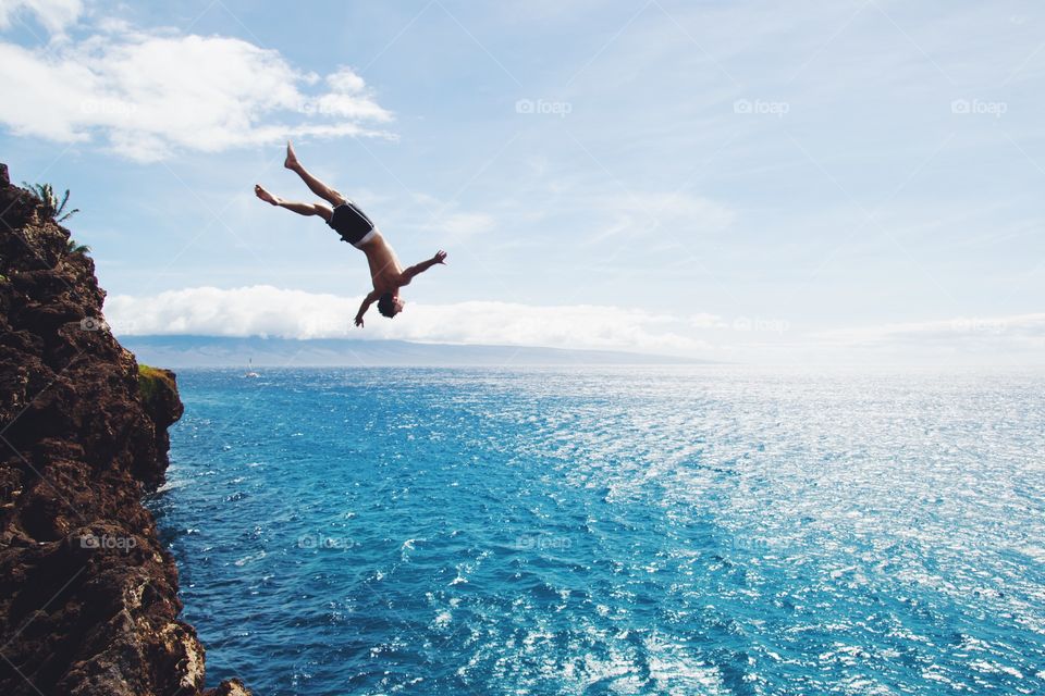 Man diving into sea