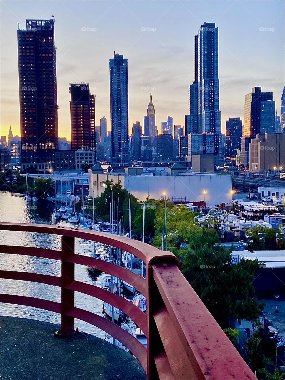 This is the amazing view of “Newtown Creek” from the “Pulaski Bridge” on a warm balmy Indian summer evening in early October 2023. The combined skyline of LIC, Queens and of “Manhattan” can be seen from here. Hypnotic Productions