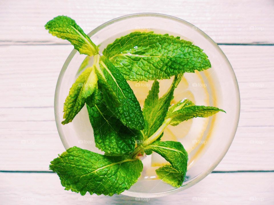 cocktail of lemon and mint leaves