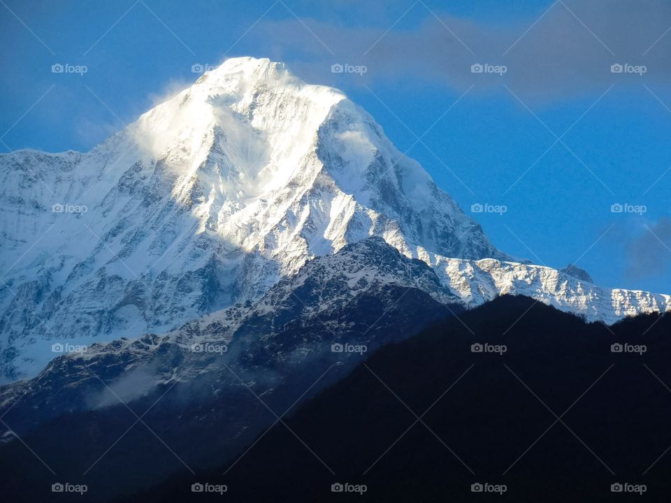 Majestic Huinchuli in the evening as the sun goes down. Photo taken on the Annapurna Base Camp Trek in Nepal.