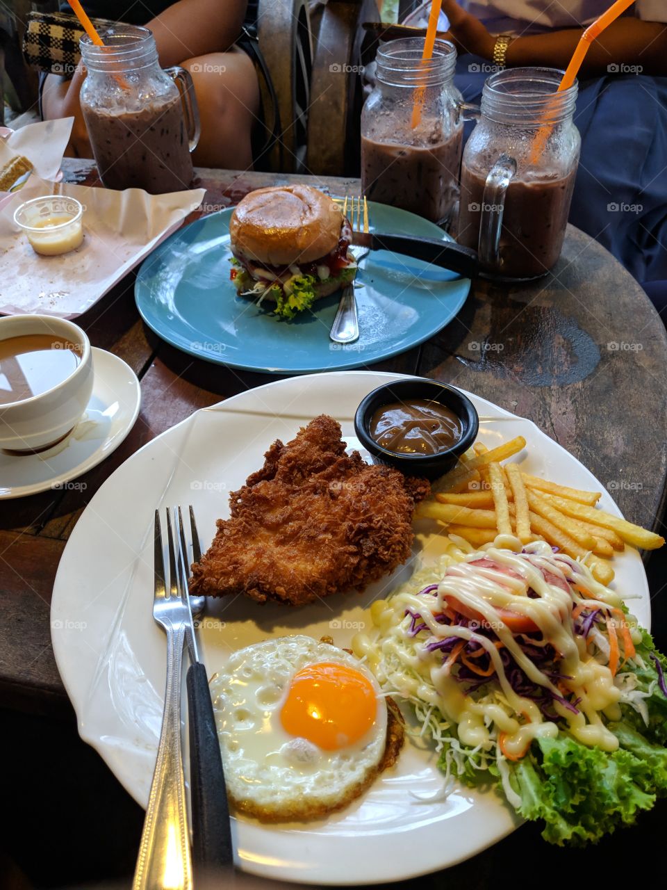 Fried Chicken Steak with egg and fries also salad