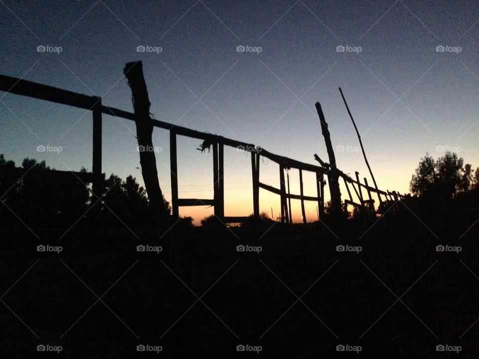 Sunset Fence Silhouette. Silhouette fence at sunset