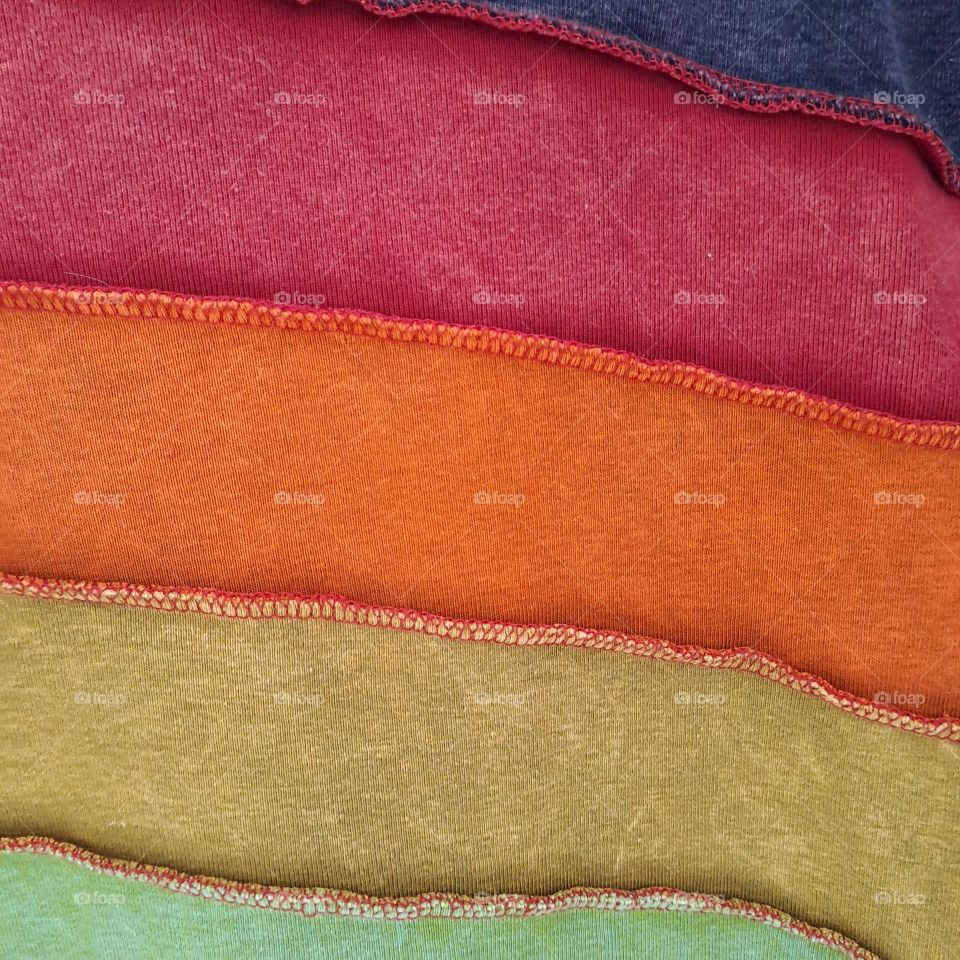 textured bright coloured material close up