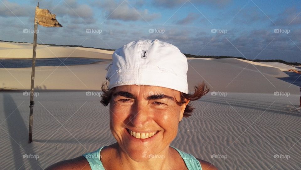 Woman with hat against desert 