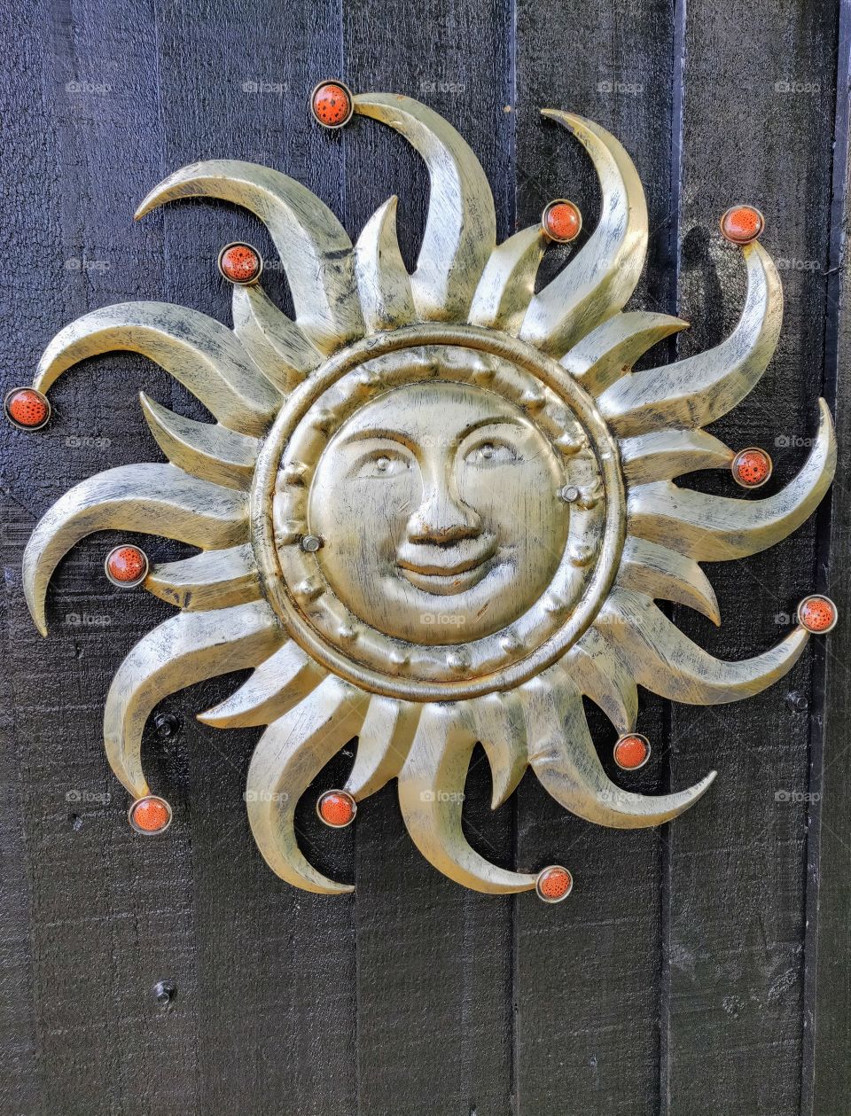 Sun sign on a wooden door.