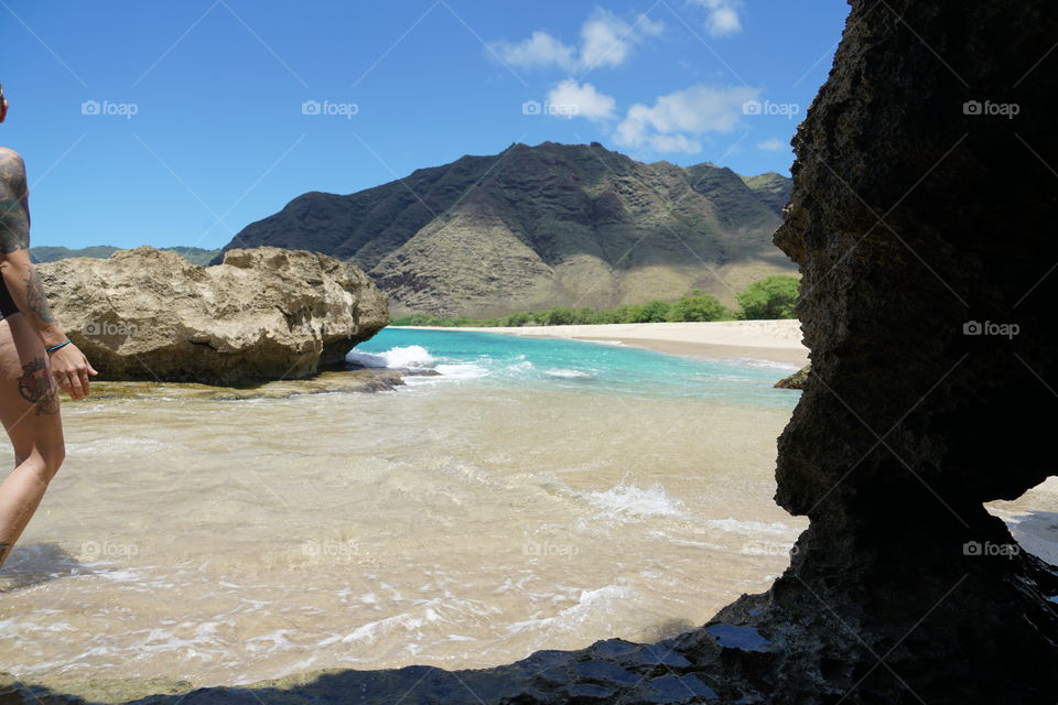 View from a cave on the west side of Oahu! Beautiful waves and white sand beaches 