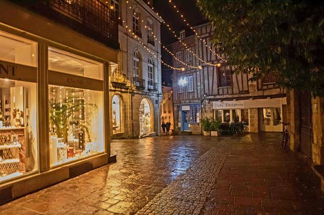 Illuminated window displays of retail shops in Vannes at Christmas time