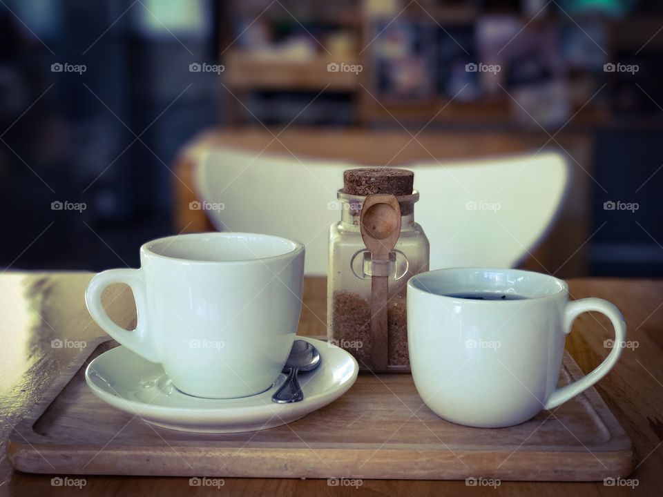 Cup of coffee and tea on wooden table background