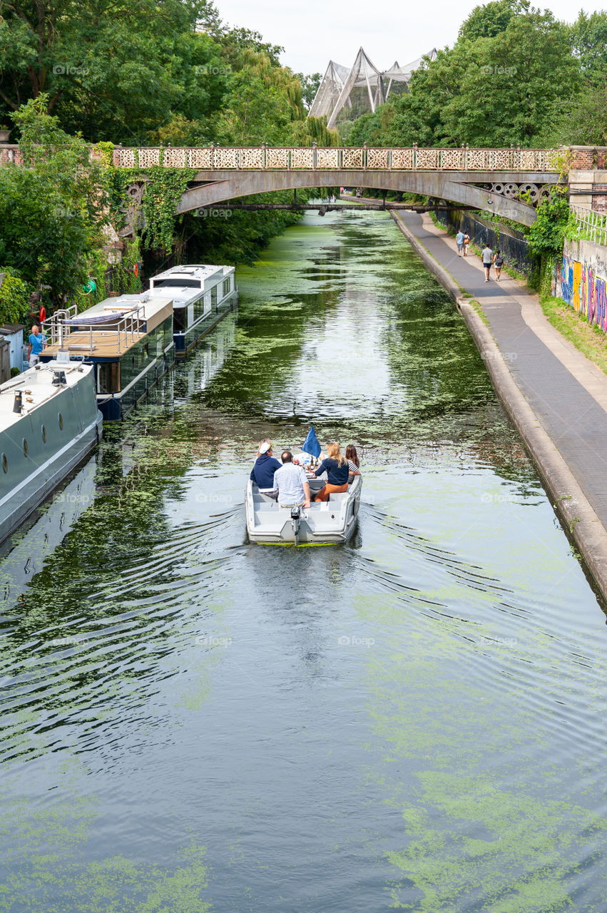 Motorboat picnic on Regent's Canal in Regent's Park. London. UK