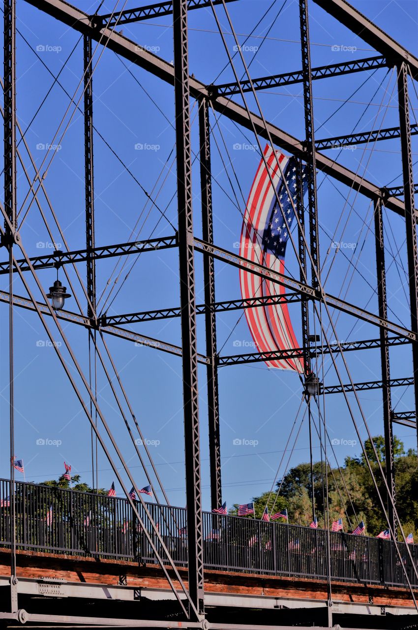 architectural engineering, footbridge showcasing the American flag.