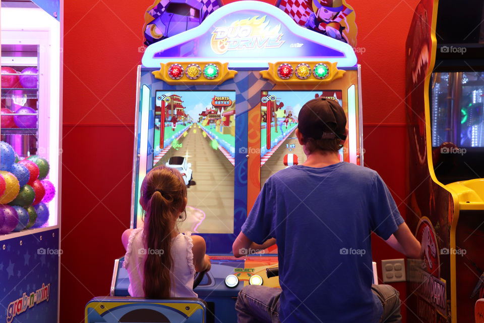 Siblings challenging each other in a Video Game