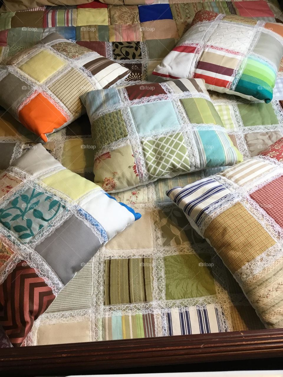 A patchwork pillow -  The absolute star of this project is the beautiful patchwork design that is created using 4 – Four Patch blocks sewn together into a mini quilt top