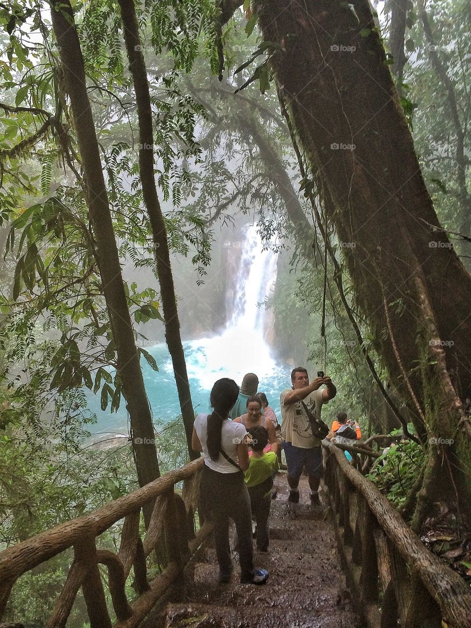 Walking the steps to the blue waterfall at Rio Celeste