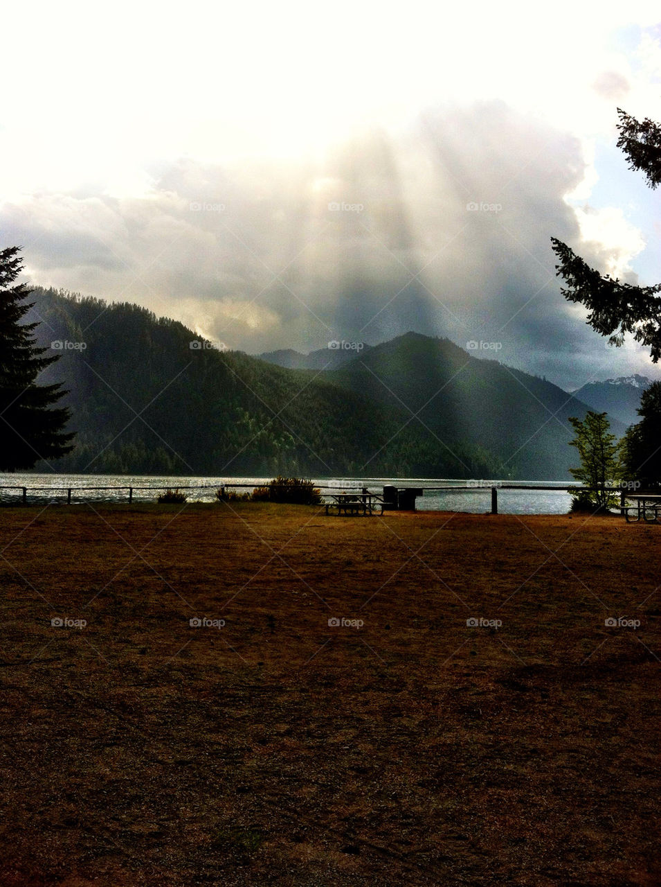 clouds sun lake rays by kimikaboo