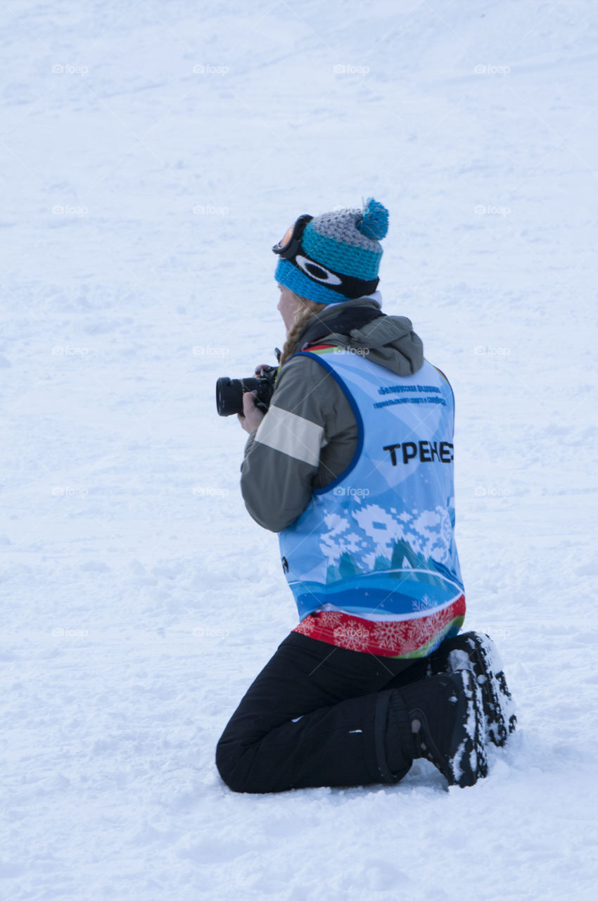 photographer taking pictures in the snow in the winter