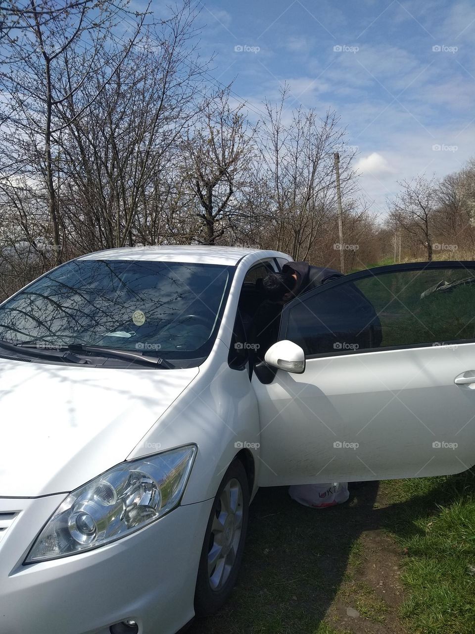 White car in the spring on the seletian road