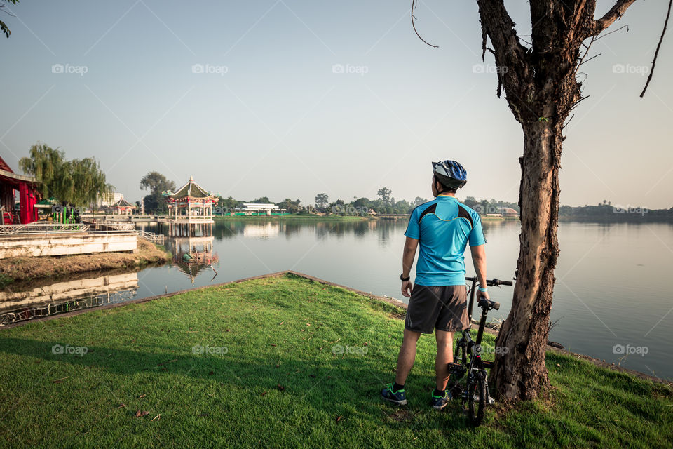 Man with bike in the park 