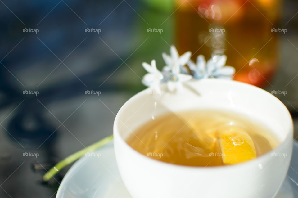 Lemon tea with white flower