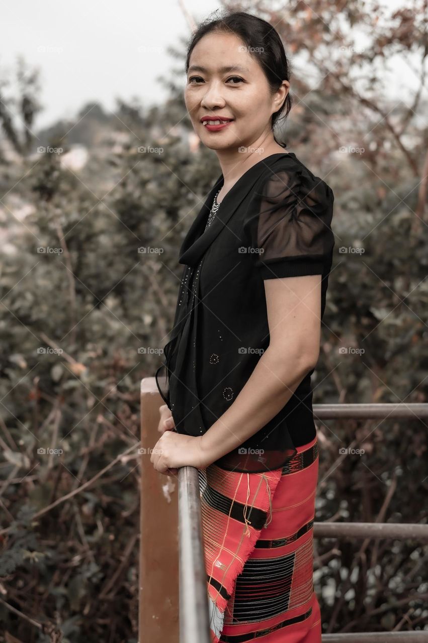 Paying respect to motherhood and honouring Mother's everywhere, a Tangkhul Naga mother poses for a portrait shot.