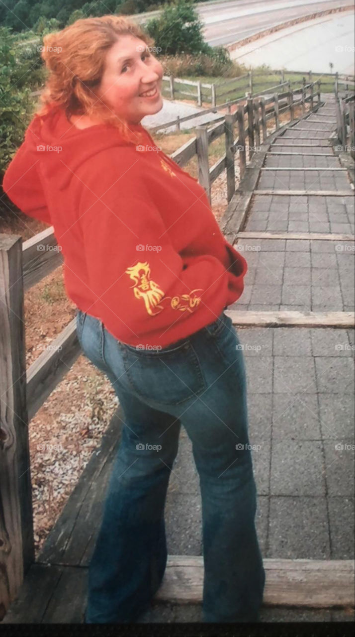 It looks vintage because it is! Circuit 1999. Red hoodie with popular Asain design. Flare jeans with the wide boot cut.