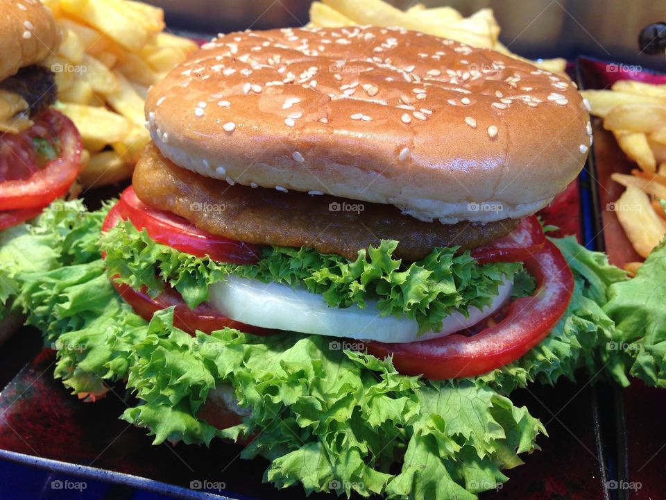 Delicious Berger and French fried on plate