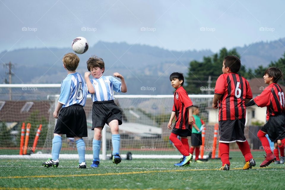 Young Boys Playing Team Soccer