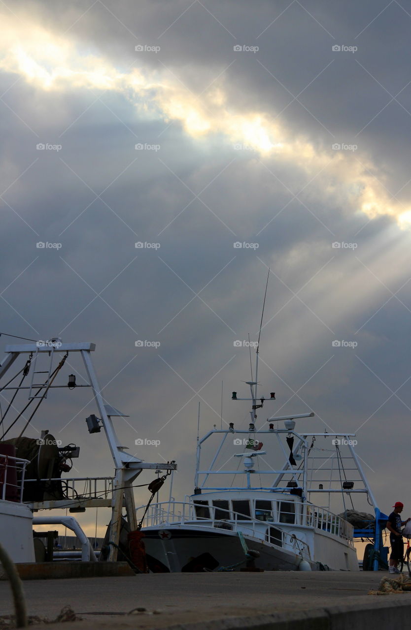 fishing boats at the Pier under sunrays