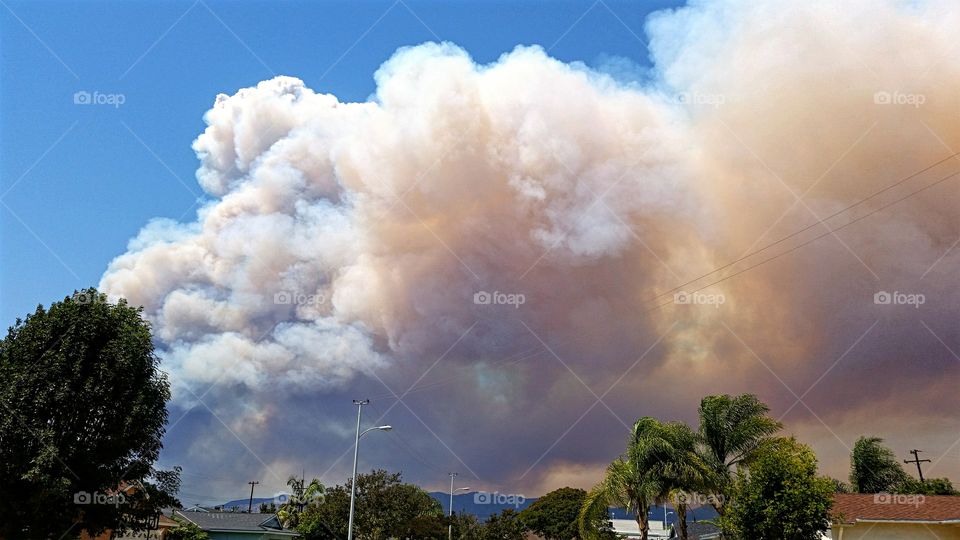 Smoke from two separate brush fires combine into one massive cloud of smoke!