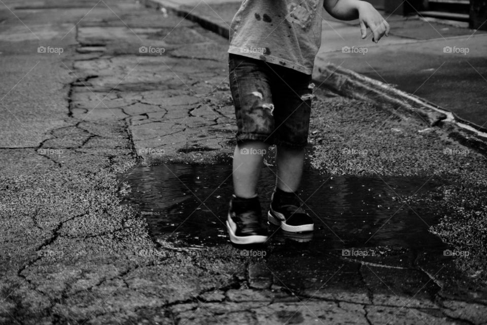 Little boy playing with water in New York 