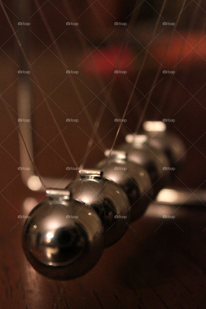 This is a up close picture of the balls from a Newtons Cradle.