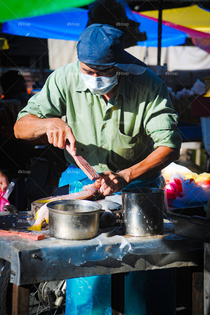Man cleaning fish 