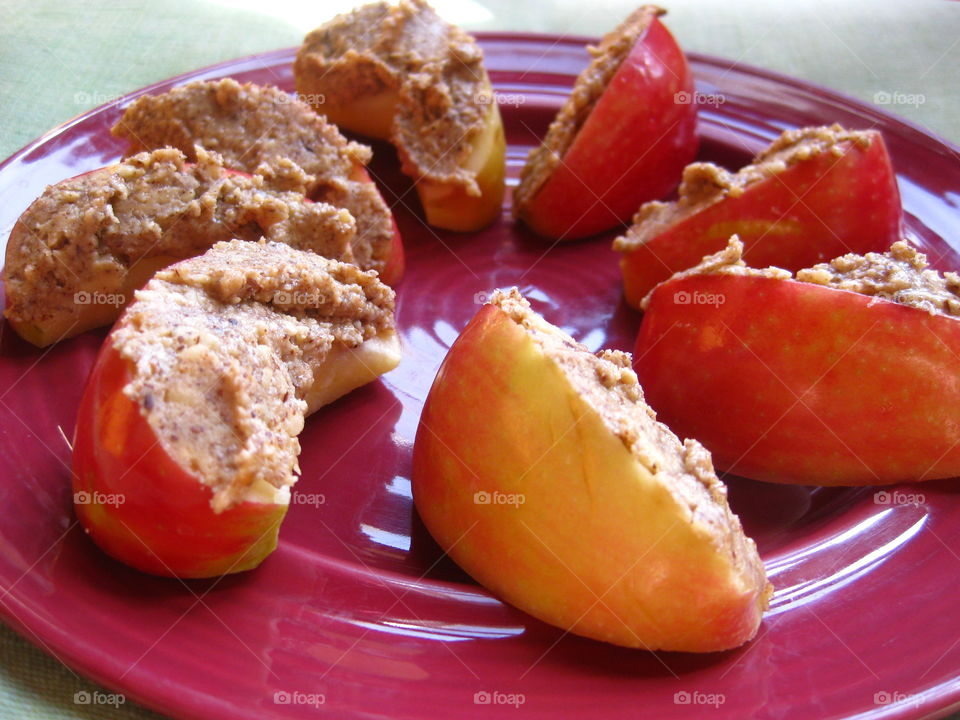 Apples and Almond Butter. Sliced organic Jonagold apples topped with organic almond butter. 
