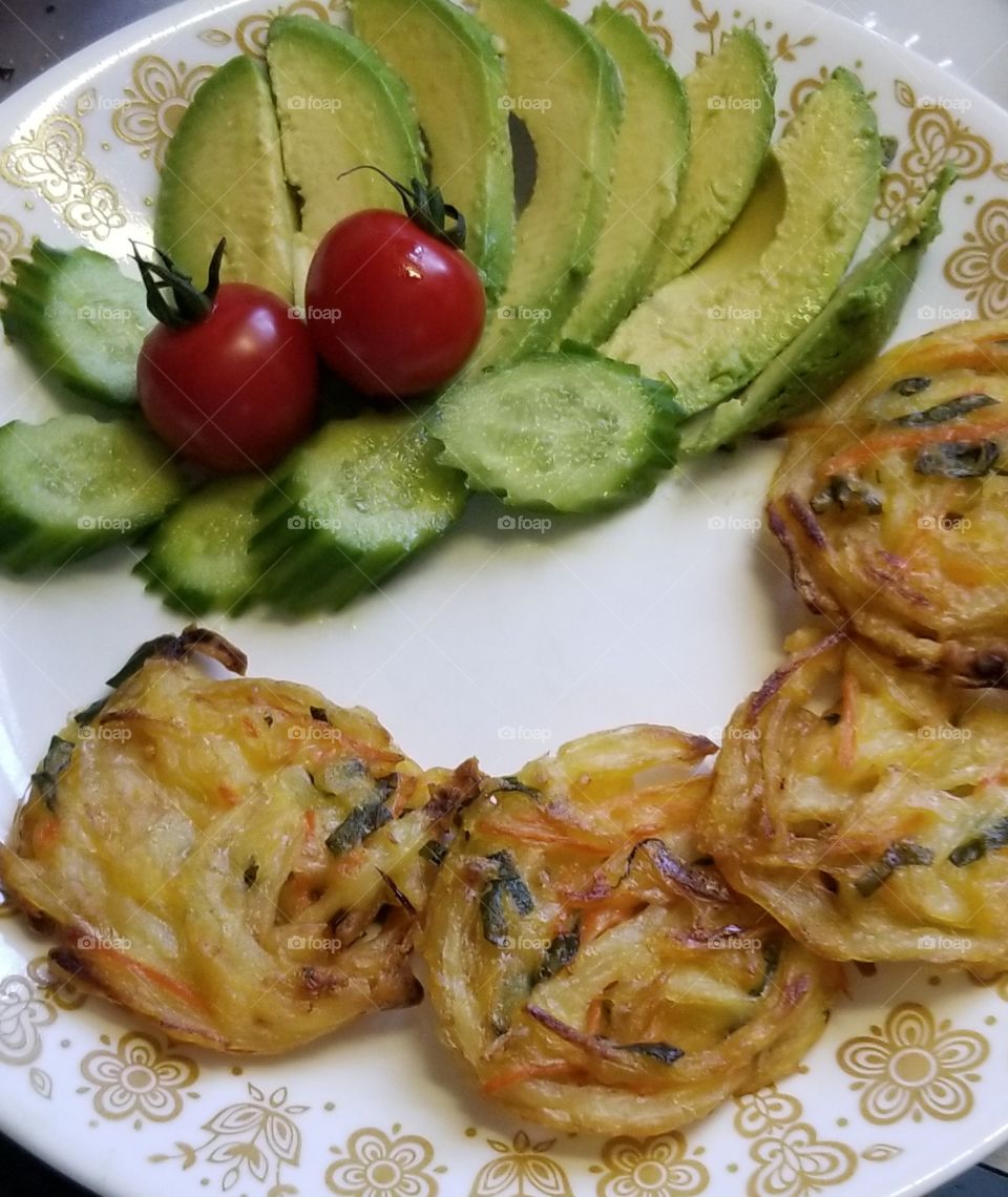 Just veggies......baked sweet onion, carrot and kale veggie nests, sliced baby cucumber, sliced Hass  avocado, and a couple of cherry tomatoes. Fresh and flavorful.
