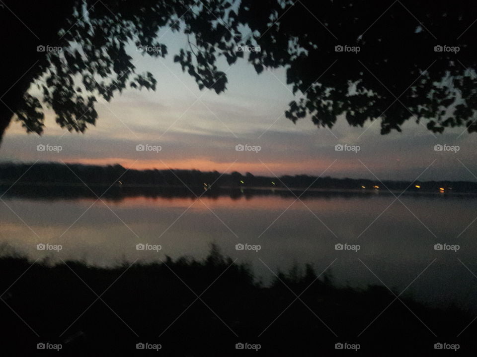 a sunrise by a lake
