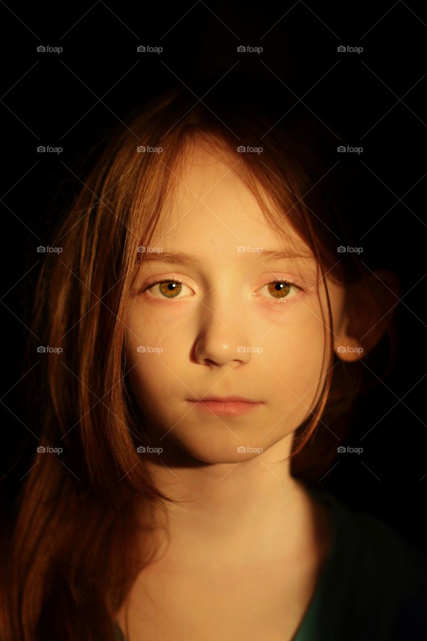 Portrait of a daughter in the setting sun