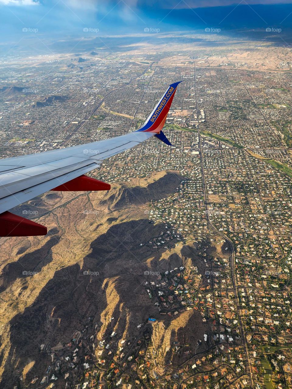 Flying in to the Phoenix Sky Harbor International Airport during a day when the monsoon kicked up makes for interesting scenery