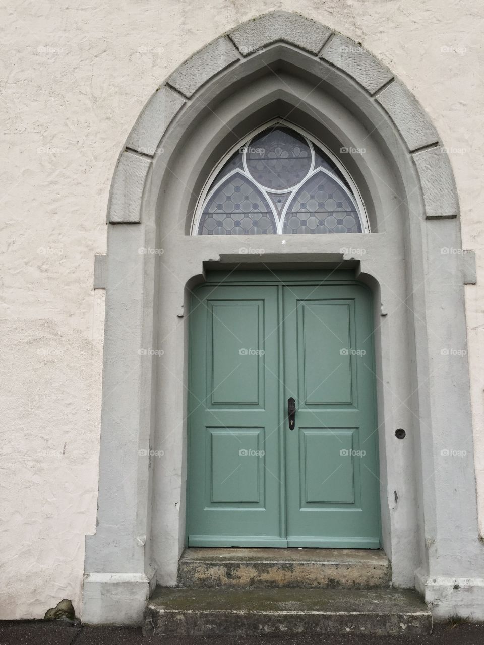 Green door with ornaments 