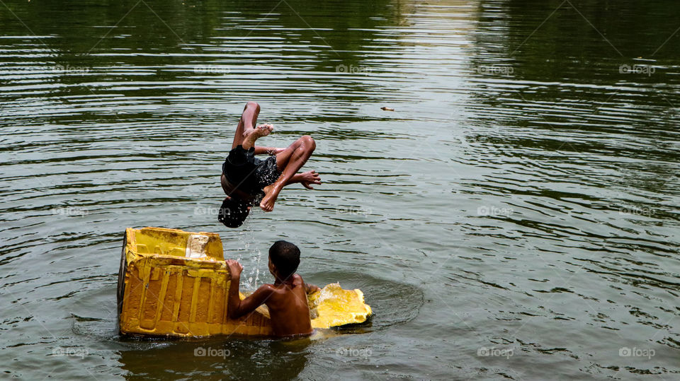 A Joyful story of village boys who was enjoying diving in to the pond.... summer enjoyment