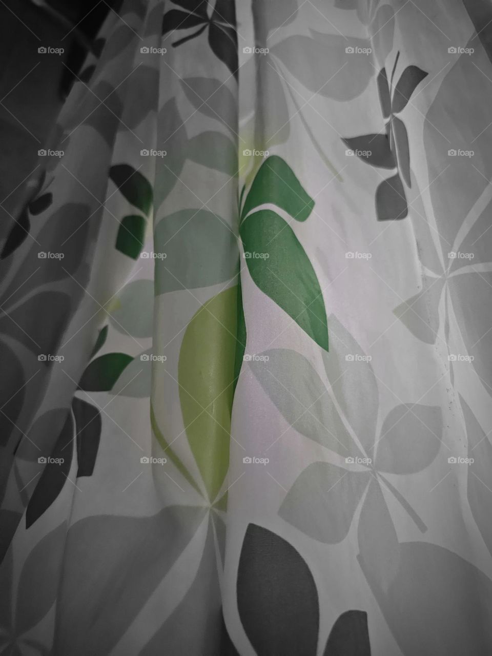 Shades of green leaves on shower curtain