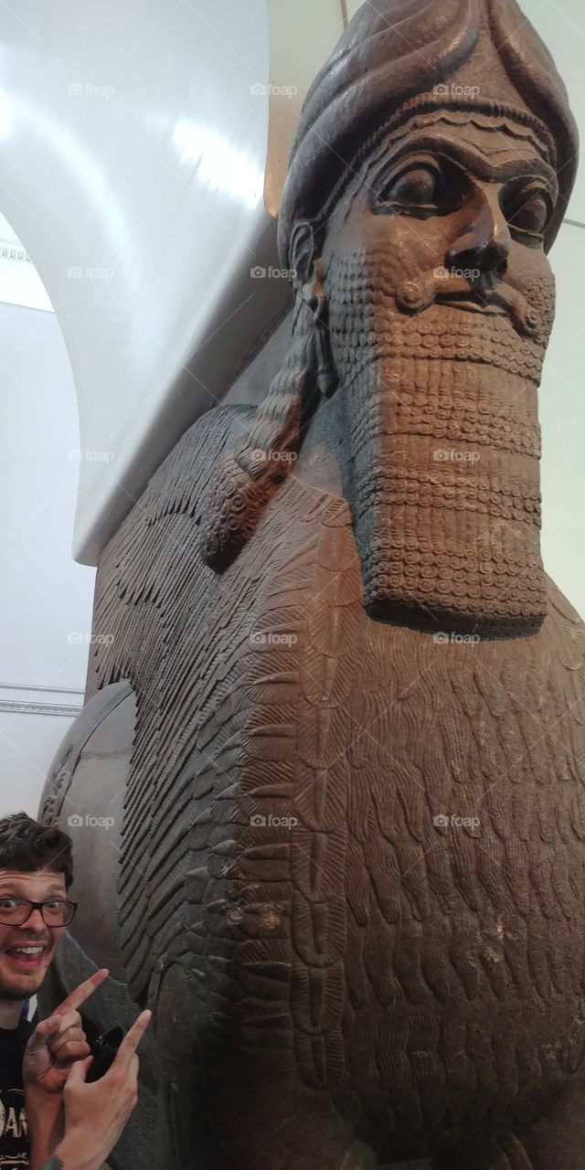 giant anciant stone statue inside museum